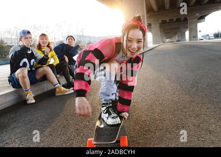 Young people skateboarding Stock Photo