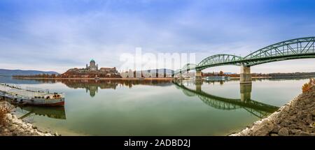 Esztergom, Hungary - Panoramic view of the beautiful Maria Valeria Bridge and Basilica of the Blessed Virgin Mary at Esztergom on an autumn morning. O Stock Photo