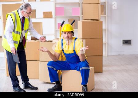 Professional movers doing home relocation Stock Photo