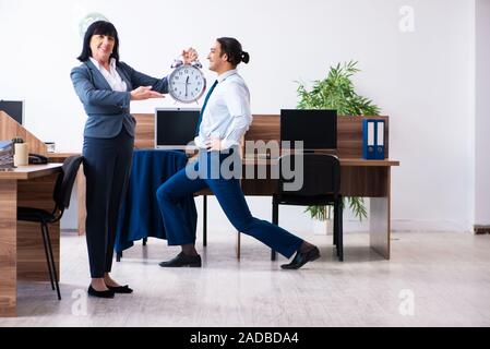 Male employee doing sport exercises in the office Stock Photo