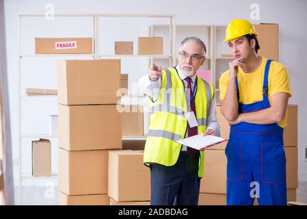 Professional movers doing home relocation Stock Photo
