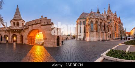 Budapest, Hungary - Panoramic view of the North gate of the Fisherman's Bastion (Halaszbastya) and Matthias Church with a beautiful autumn sunrise and Stock Photo