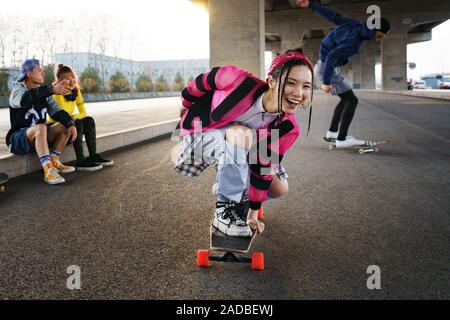 Young people skateboarding Stock Photo