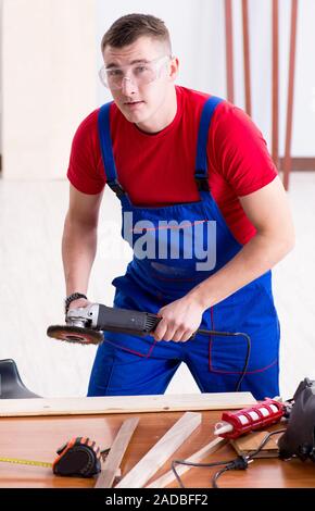 Contractor working in the workshop Stock Photo