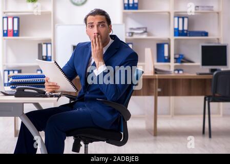 Young male Businessman working in the office Stock Photo