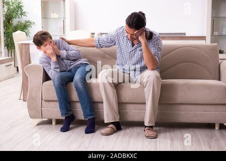 Father beating and punishing his sone Stock Photo