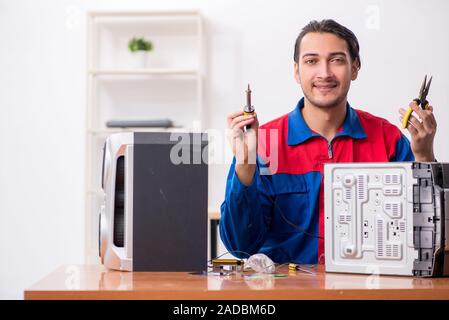 Young engineer repairing musical hi-fi system Stock Photo