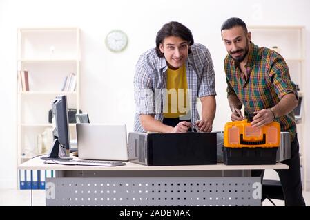 IT engineers working on hardware issue Stock Photo