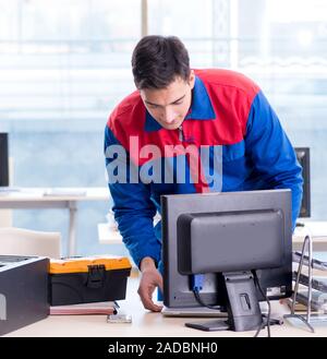 The computer repairman specialist repairing computer desktop Stock Photo