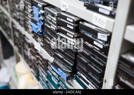 Recycling centre workplace charity. Wiped hard drives waiting to be installed in computers being refurbished at LAMH Recycle Ltd, Motherwell, Scotland Stock Photo