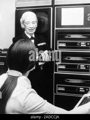 Grace Murray Hopper (1906-1992), American computer scientist and US Navy Rear Admiral, standing next to DECpack computer equipment. Hopper trained as Stock Photo