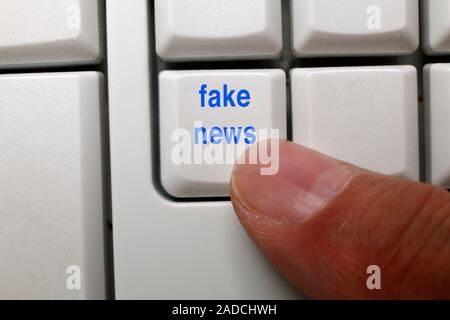 Fake news key on a computer keyboard. Stock Photo
