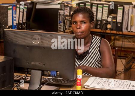 Hospital administrator working at a computer. Photographed in St Mary's Hospital, Lacor, Gulu, Uganda. Stock Photo