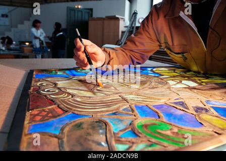 Stained glass restoration. Restorer working on stained glass from Leon Cathedral, Leon, Spain. This cathedral, built from the 13th to the 15th century Stock Photo