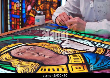 Stained glass restoration. Restorer working on stained glass from Leon Cathedral, Leon, Spain. This cathedral, built from the 13th to the 15th century Stock Photo