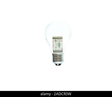 A light bulb with hundred dollar banknote as the fillament symbolysing spending Stock Photo