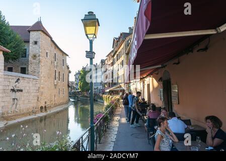 ANNECY, FRANCE - SEPTEMBER 13, 2019 : tourists enjoy historic atmosphere in downtown of Annecy, nicknamed the 'Pearl of French Alps'. Stock Photo