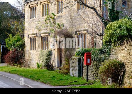 Winter in Broadwell a cotswold village near Stowe-on-the-Wold Gloucestershire. UK. cottage with Post box Stock Photo