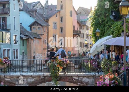 ANNECY, FRANCE - SEPTEMBER 13, 2019 : tourists enjoy historic atmosphere in downtown of Annecy, nicknamed the 'Pearl of French Alps'. Stock Photo