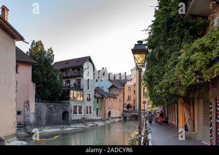 ANNECY, FRANCE - SEPTEMBER 13, 2019 : tourists enjoy historic atmosphere in downtown of Annecy, nicknamed the 'Pearl of French Alps'. Stock Photo