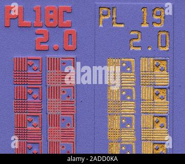 Computer chip. Coloured scanning electron micrograph (SEM) of a computer chip (microchip, microprocessor, integrated circuit) surface. Microchips are Stock Photo