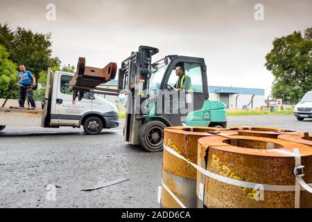 Metalworks. Worker using a forklift to load forged steel parts for delivery. Photographed at Ecosteel, Scotland, UK. Stock Photo