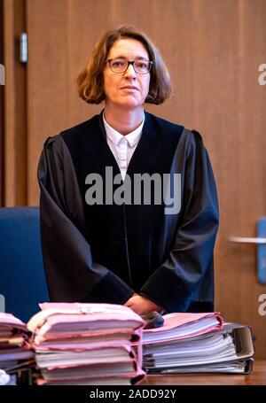 Detmold, Germany. 04th Dec, 2019. Sabine Diekmann, presiding judge, enters the hall of the district court Detmold. The public prosecutor's office in Detmold accuses the accused of 'driving licence king' Herbrechtsmeier of 505 cases of fraud which allegedly led to a total loss of almost 650,000 euros. Credit: David Inderlied/dpa/Alamy Live News Stock Photo