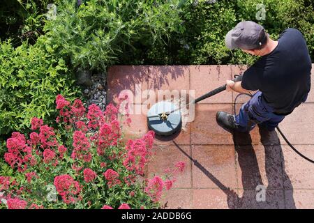 Cleaning stone slabs with the high-pressure cleaner Stock Photo