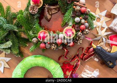 Making Christmas Advent wreath on table top view Stock Photo