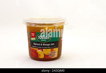 Alberton, South Africa - a tub of Rhodes apricot and mango jam isolated on a clear background image with copy space in horizontal format Stock Photo