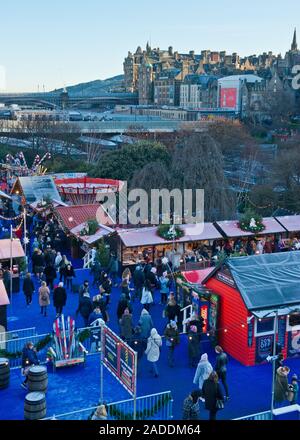 Edinburgh Christmas market and fairground. With Waverley railway station in background. Edinburgh, Scotland Stock Photo