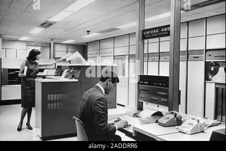 UNIVAC 490 computer operators, 1960s. The computer model being used here is the UNIVAC 490, used by organisations such as NASA, the US Air Force, and Stock Photo