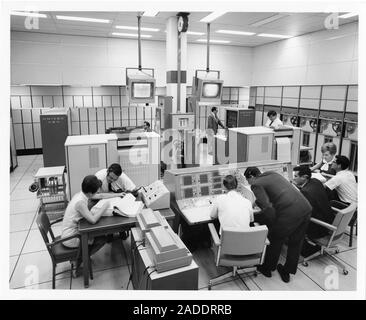 UNIVAC 494 computer operators at NASA, 1960s. The computer model being used here by NASA is the UNIVAC 494, an improved version of the UNIVAC 490. The Stock Photo