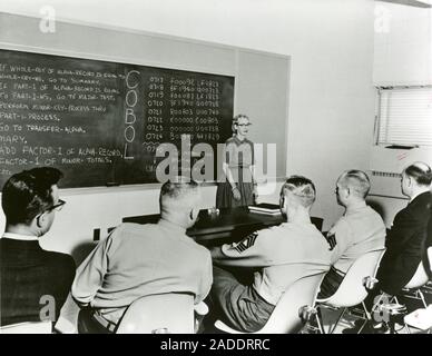 Hopper teaching COBOL computer programming, 1960s. US computer scientist Grace Murray Hopper (1906-1992) was part of the team that developed the first Stock Photo