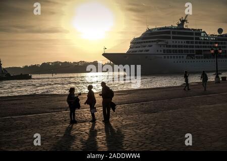 Evening atmosphere with cruise ship in Venice. Stock Photo