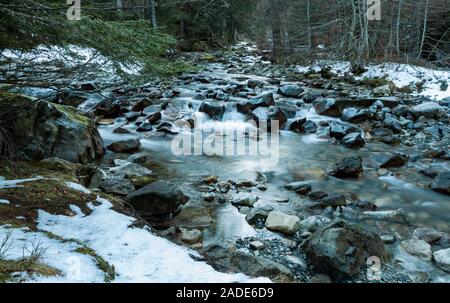 Winter mountain river banks in Pyrenees France Stock Photo