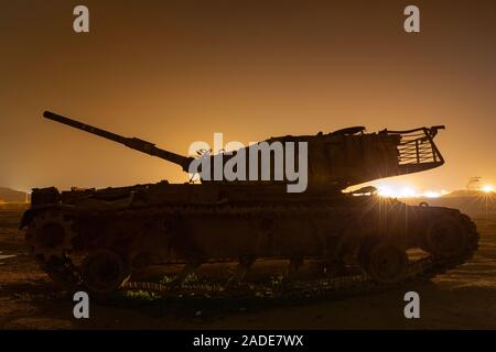 Light pollution and tank in Israeli desert. Stock Photo