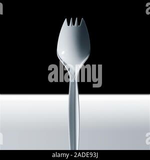 Cropped image of disposable plastic fork. Stock Photo