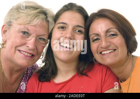 Three women, heads together, smiling. Stock Photo