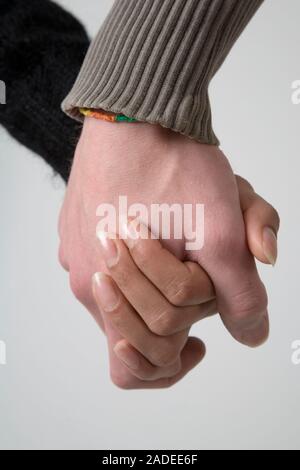Portrait of a young couple holding hands. Stock Photo