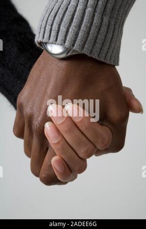 Portrait of a young couple holding hands. Stock Photo