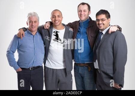 A group of men of different ages, standing together, smiling. Cleared for Mental Health and depression. Stock Photo