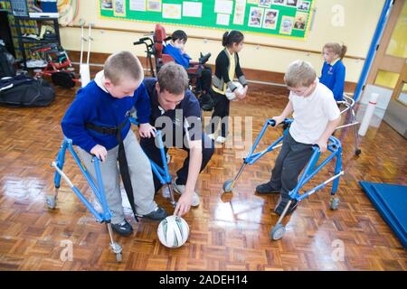 Children with disabilities playing indoor football. Stock Photo