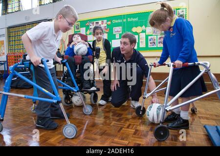 Children with disabilities playing indoor football. Stock Photo