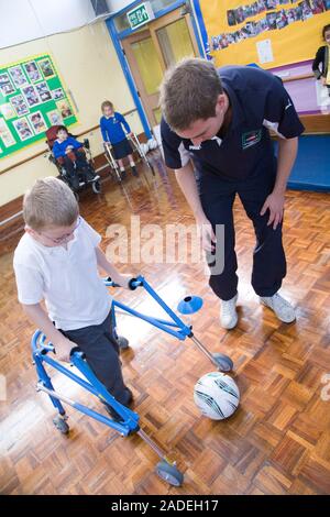 Children with disabilities playing indoor football. Stock Photo