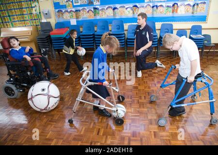 Children with disabilities playing indoor football. Stock Photo