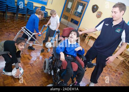 Children with disabilities playing indoor football. Stock Photo
