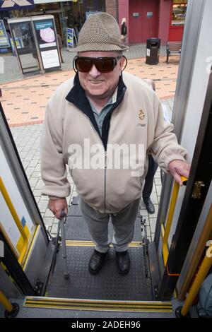 Man using platform lift to access mobile resource unit. Stock Photo