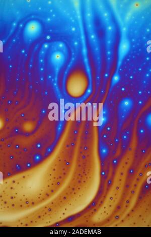 Soap bubble film iridescence, thin film interference. Iridescence is the property of certain surfaces to change colour depending on the angle of light Stock Photo