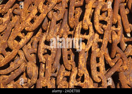 Rusty chain on quayside. Stock Photo
